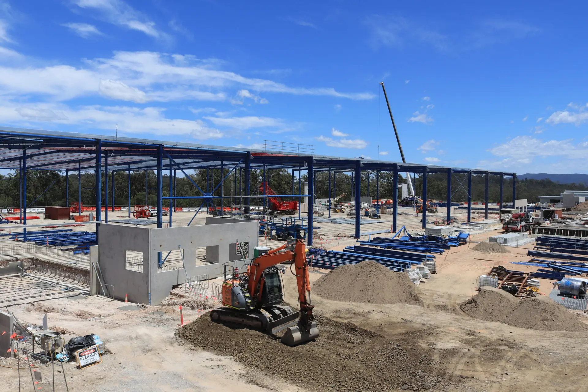 Wide-angle view of active construction site with timelapse setup in operation