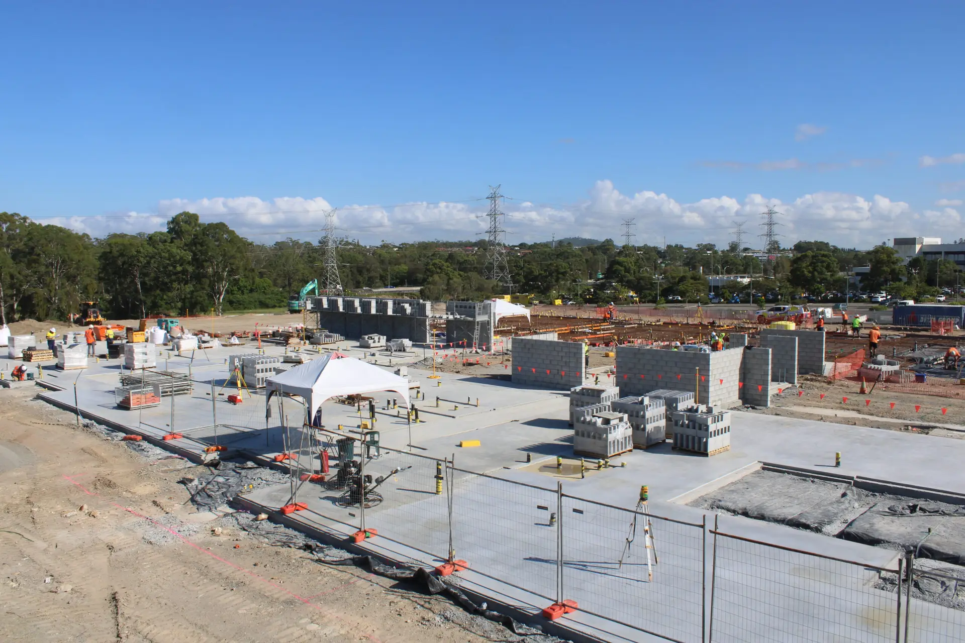 Construction timelapse camera mounted on pole overlooking active job site